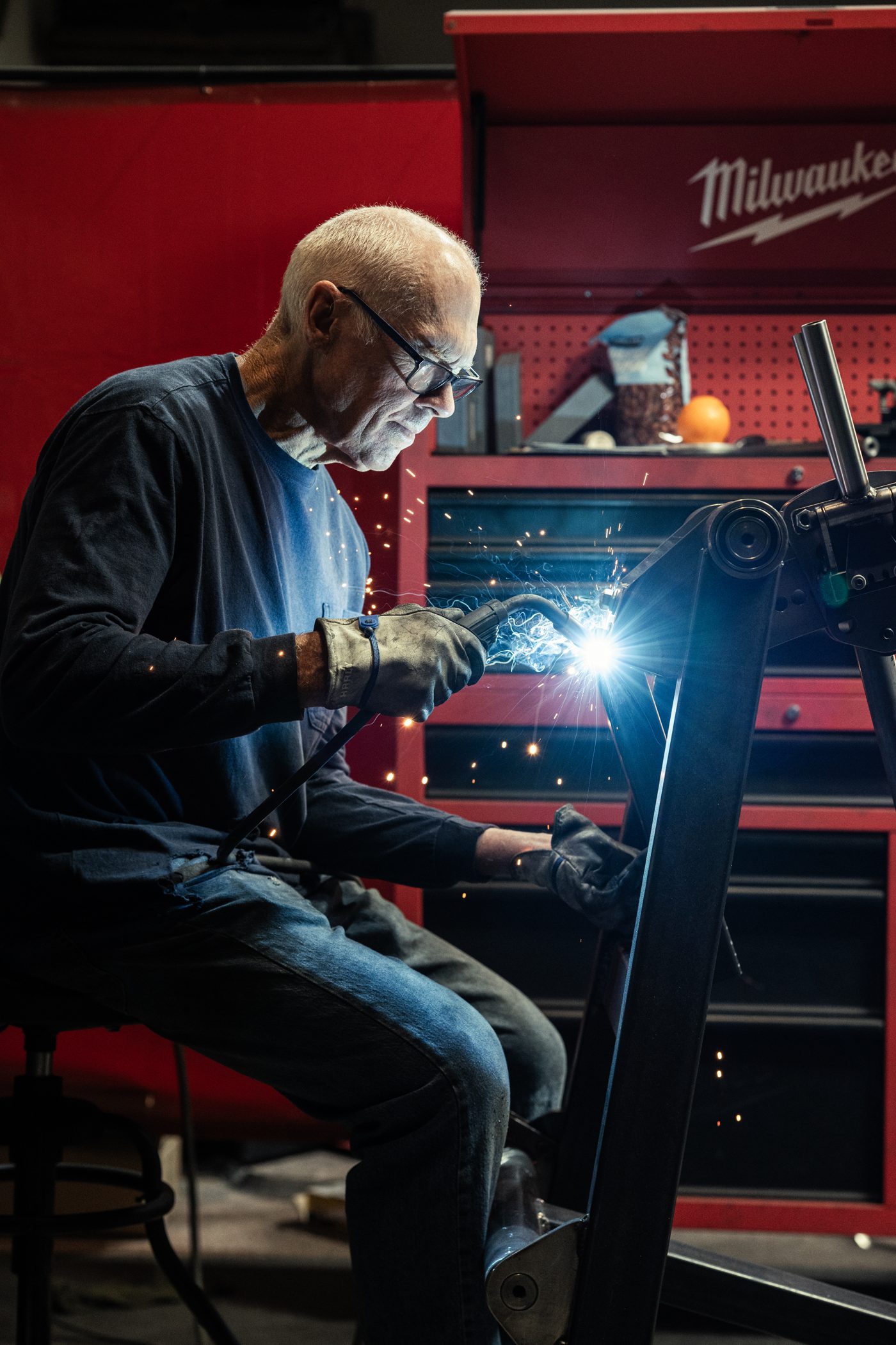 Roy Simonson welding a strength frame